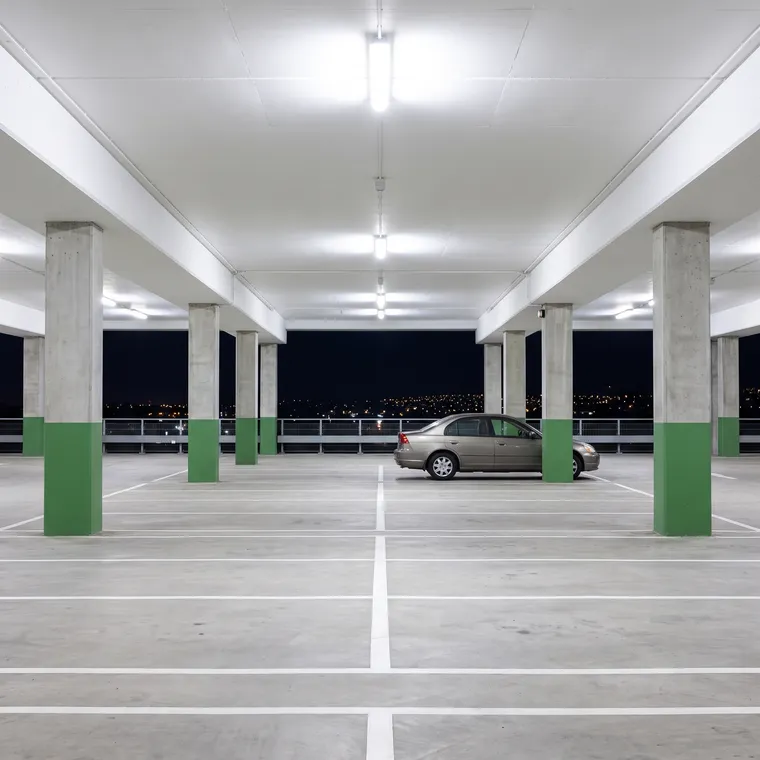 Empty covered parking level at night